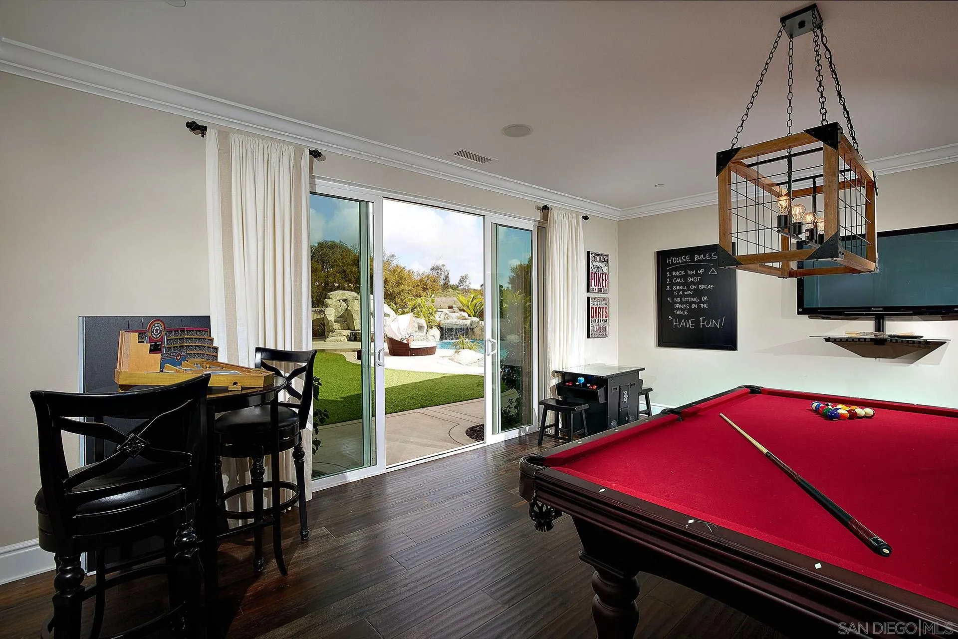 17778 Ralphs Ranch Road San Diego, CA 92127 - Photo 35 of 48 a room with furniture and wooden floor