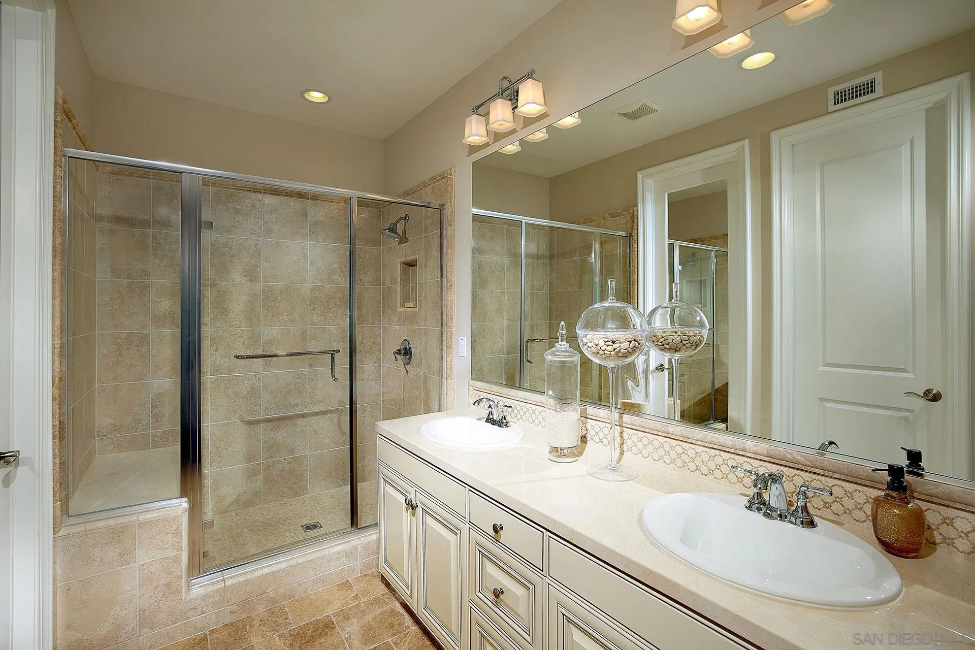 17778 Ralphs Ranch Road San Diego, CA 92127 - Photo 37 of 48 a bathroom with a shower sink and mirror