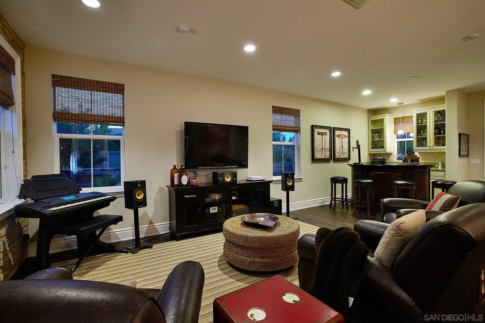 17778 Ralphs Ranch Road San Diego, CA 92127 - Photo 43 of 48 a living room with furniture a flat screen tv and kitchen view
