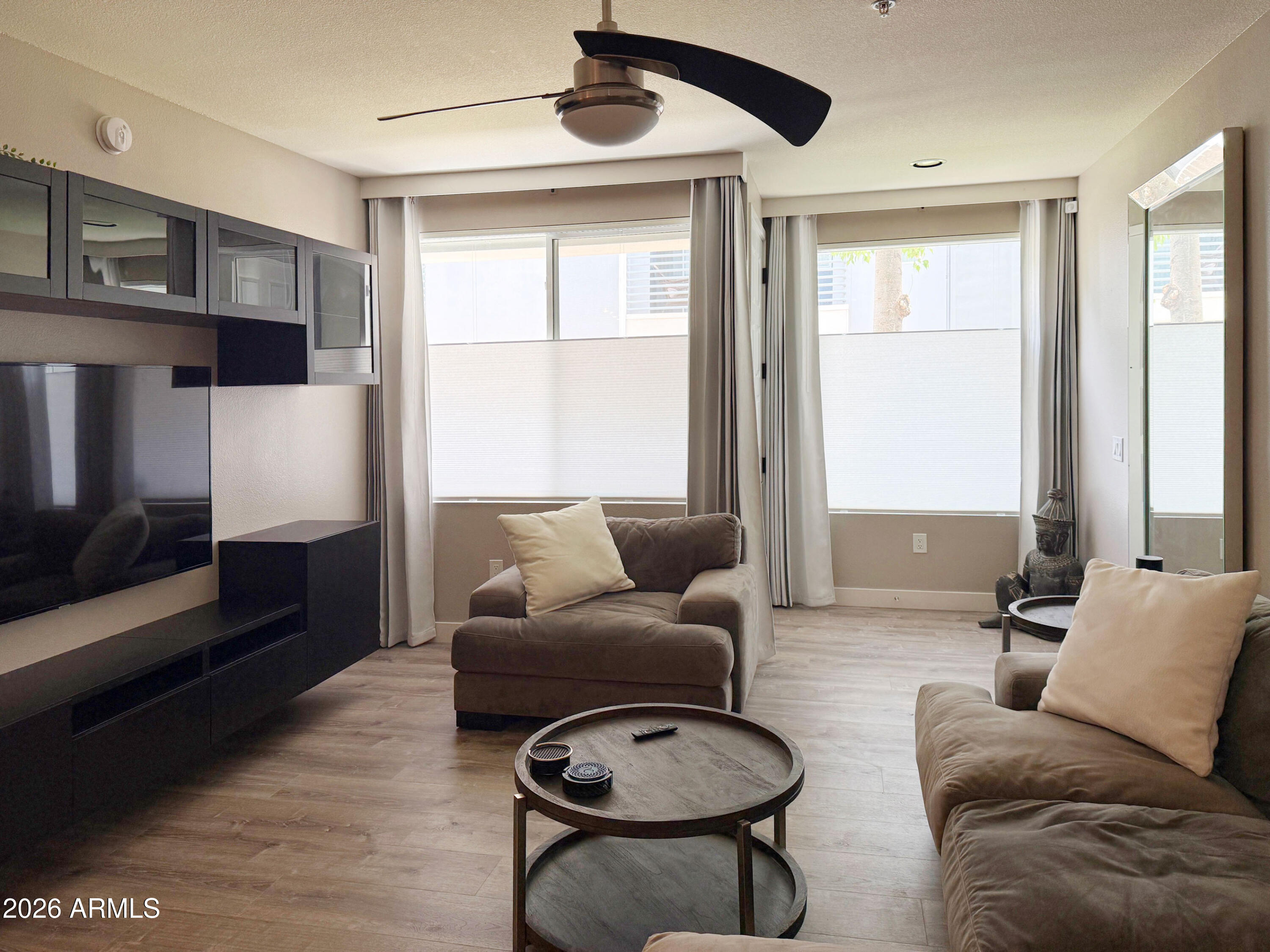 3633 North 3rd Avenue, Unit 1027 Phoenix, AZ 85013 - Photo 3 of 29 a living room with furniture and a window