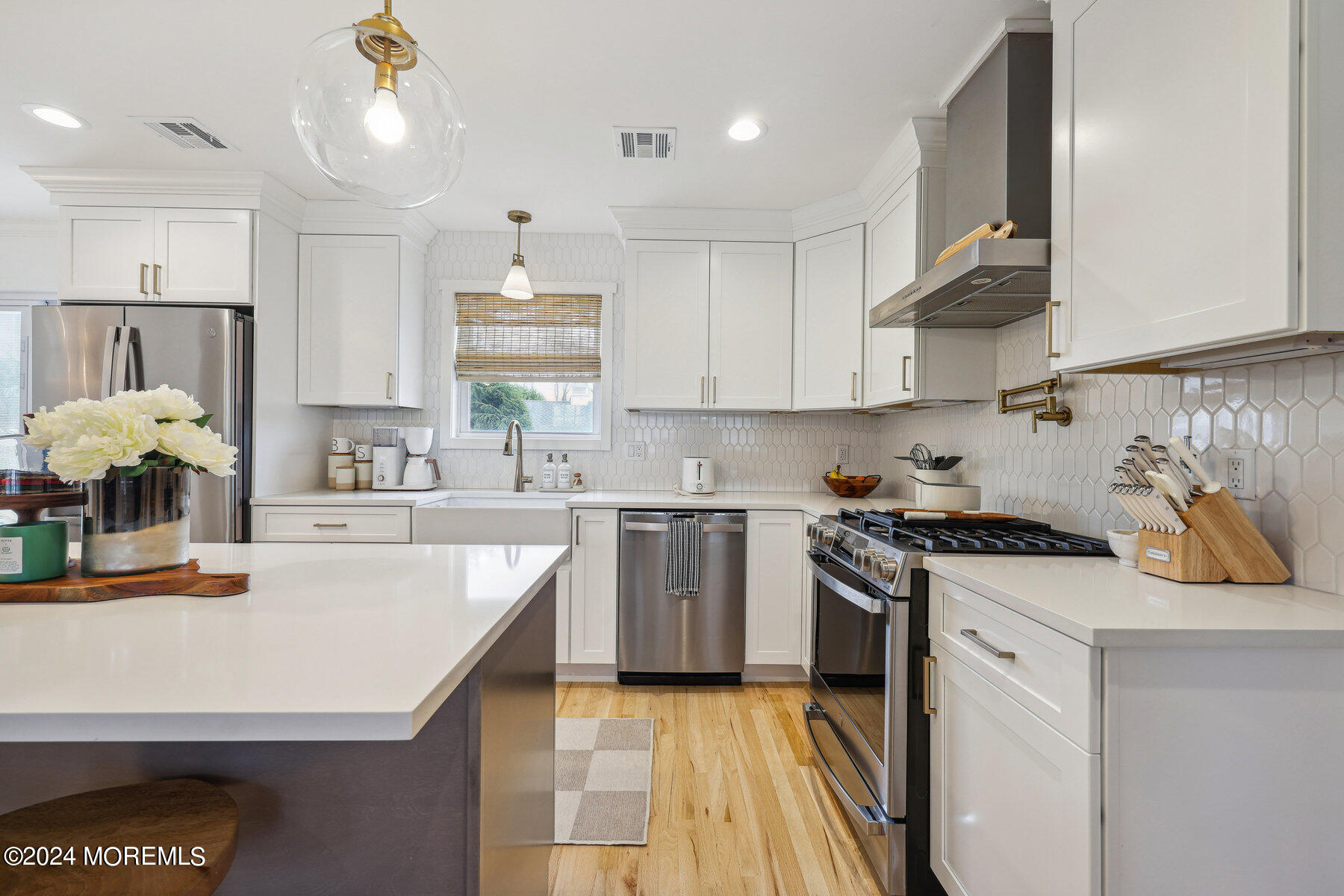 2572 Summit Road Manasquan, NJ 08736 - Photo 15 of 28 a kitchen with a stove a sink and a refrigerator