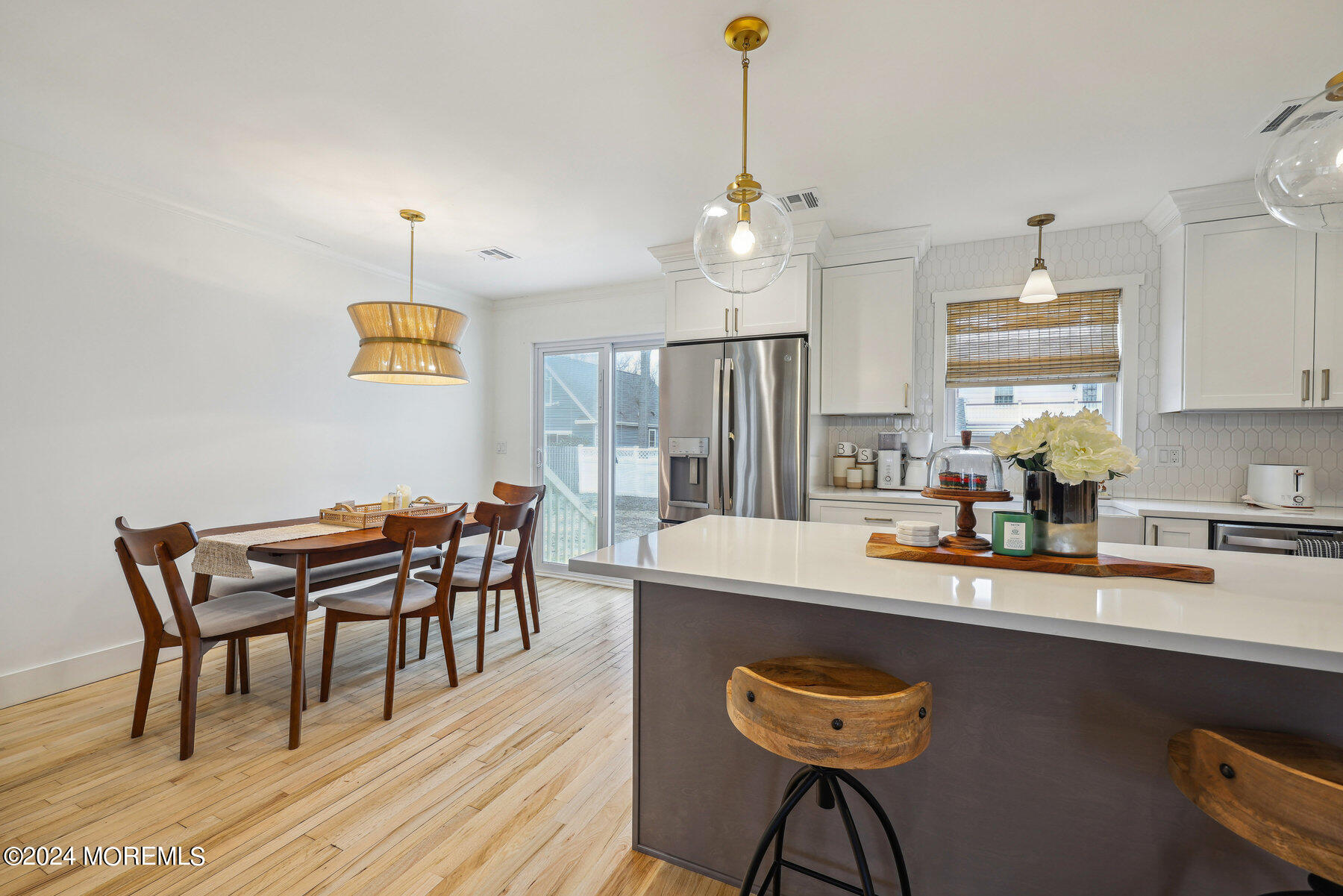 2572 Summit Road Manasquan, NJ 08736 - Photo 17 of 28 a room with stainless steel appliances kitchen island granite countertop furniture and a wooden floor