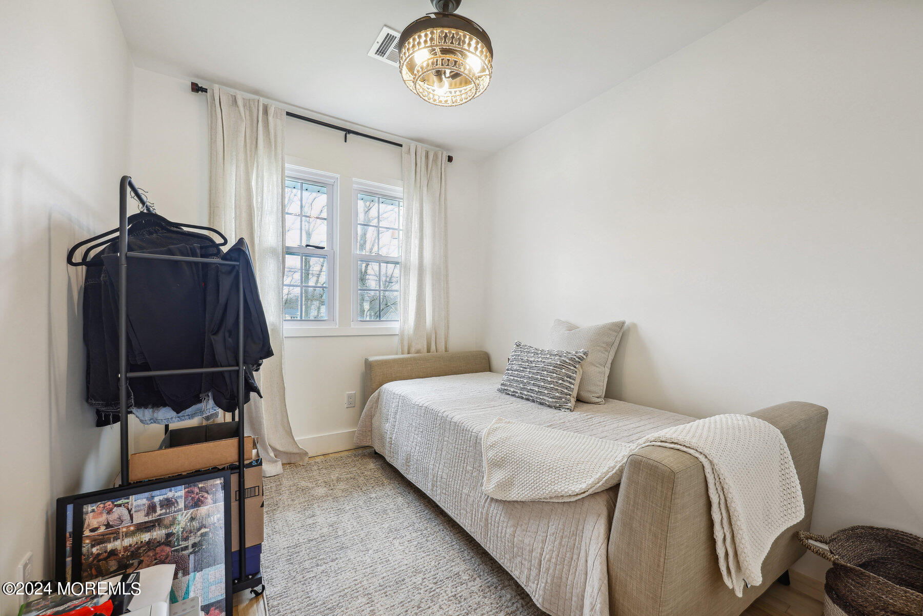 2572 Summit Road Manasquan, NJ 08736 - Photo 23 of 28 a bedroom with a bed a dresser and a window