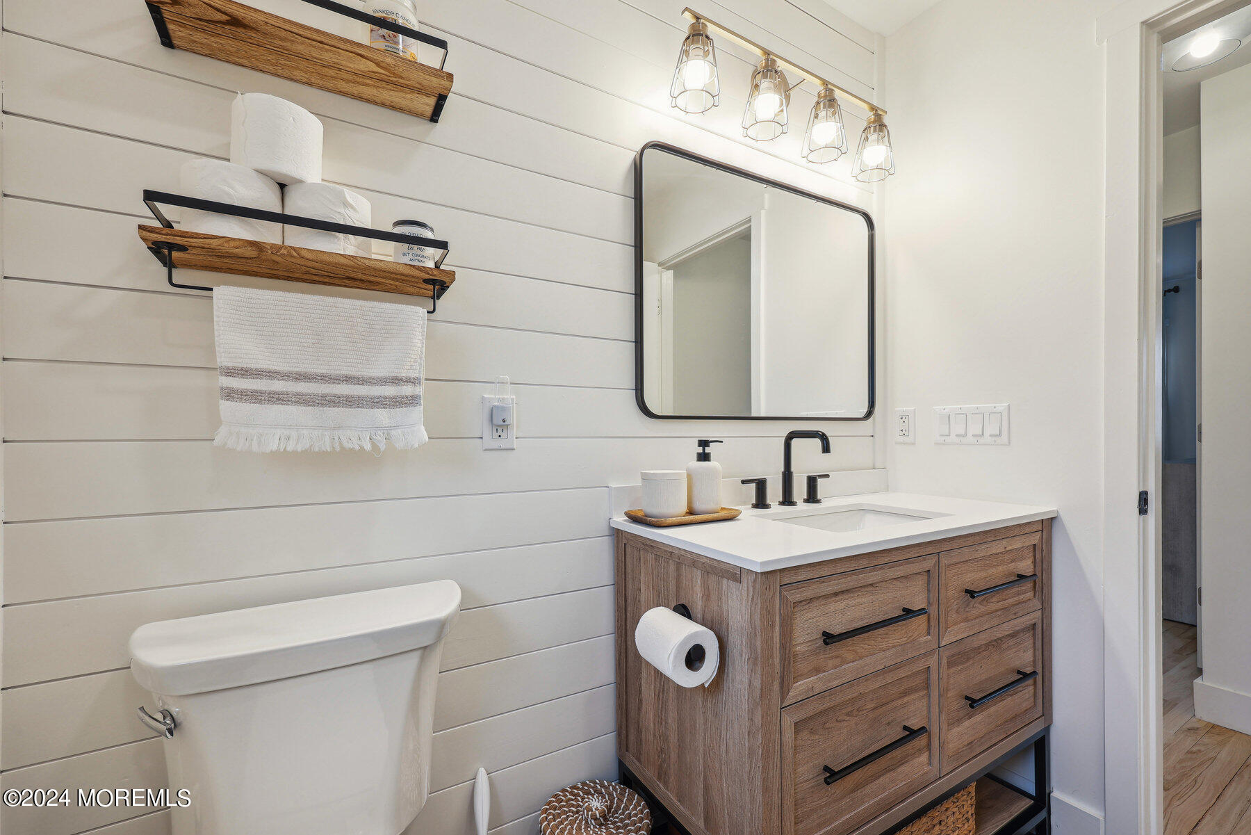 2572 Summit Road Manasquan, NJ 08736 - Photo 24 of 28 a bathroom with a sink a toilet and mirror