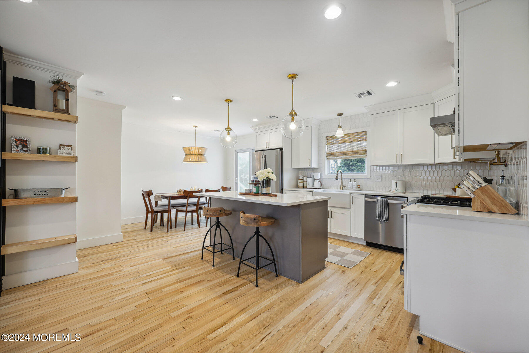 2572 Summit Road Manasquan, NJ 08736 - Photo 10 of 28 a kitchen with a table chairs wooden floors and a view of living room