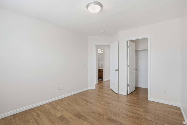 2007 Fielding Hill Lane Draper, UT 84020 - Photo 30 of 83 Spacious interior room featuring wood-finish flooring, white baseboards, and a neutral wall color