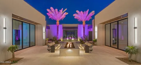 a living room with fireplace furniture and a flat screen tv