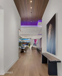 a dining room with furniture and a floor to ceiling window