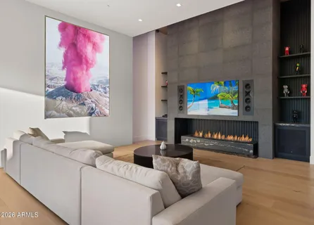 a bedroom with a bed and a painting on the wall