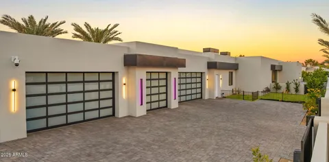 a kitchen with stainless steel appliances kitchen island granite countertop a stove a sink and a refrigerator