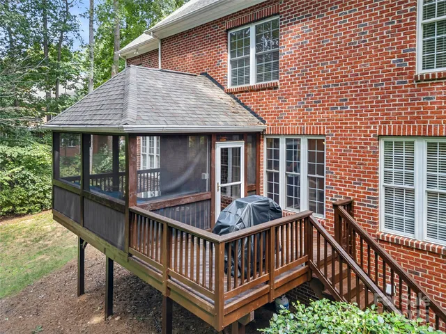 a view of a livingroom with furniture and floor to ceiling window