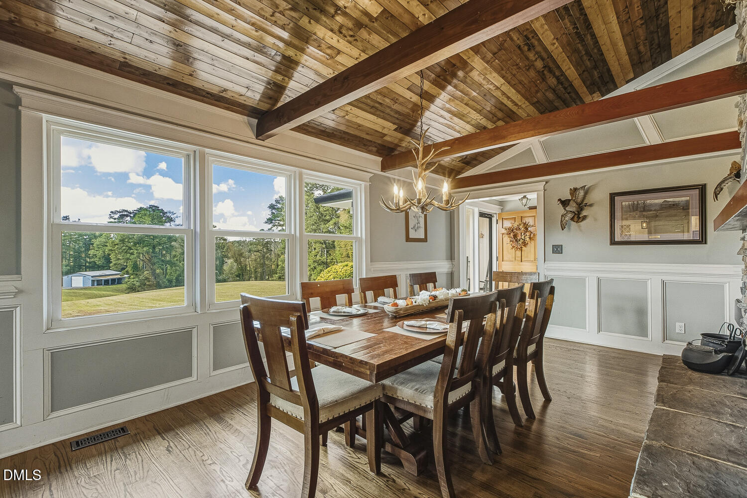 273 Wells Lane Angier, NC 27501 - Photo 11 of 52 a view of a dining room with furniture window and wooden floor