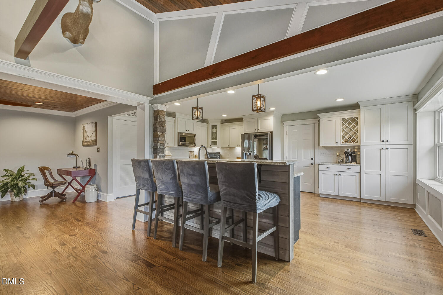 273 Wells Lane Angier, NC 27501 - Photo 19 of 52 a dining hall with stainless steel appliances kitchen island granite countertop a dining table chairs and view living room