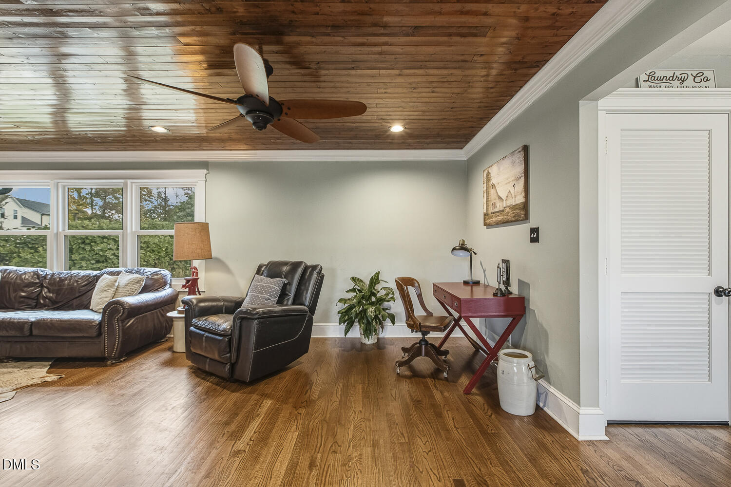 273 Wells Lane Angier, NC 27501 - Photo 23 of 52 a living room with furniture and wooden floor