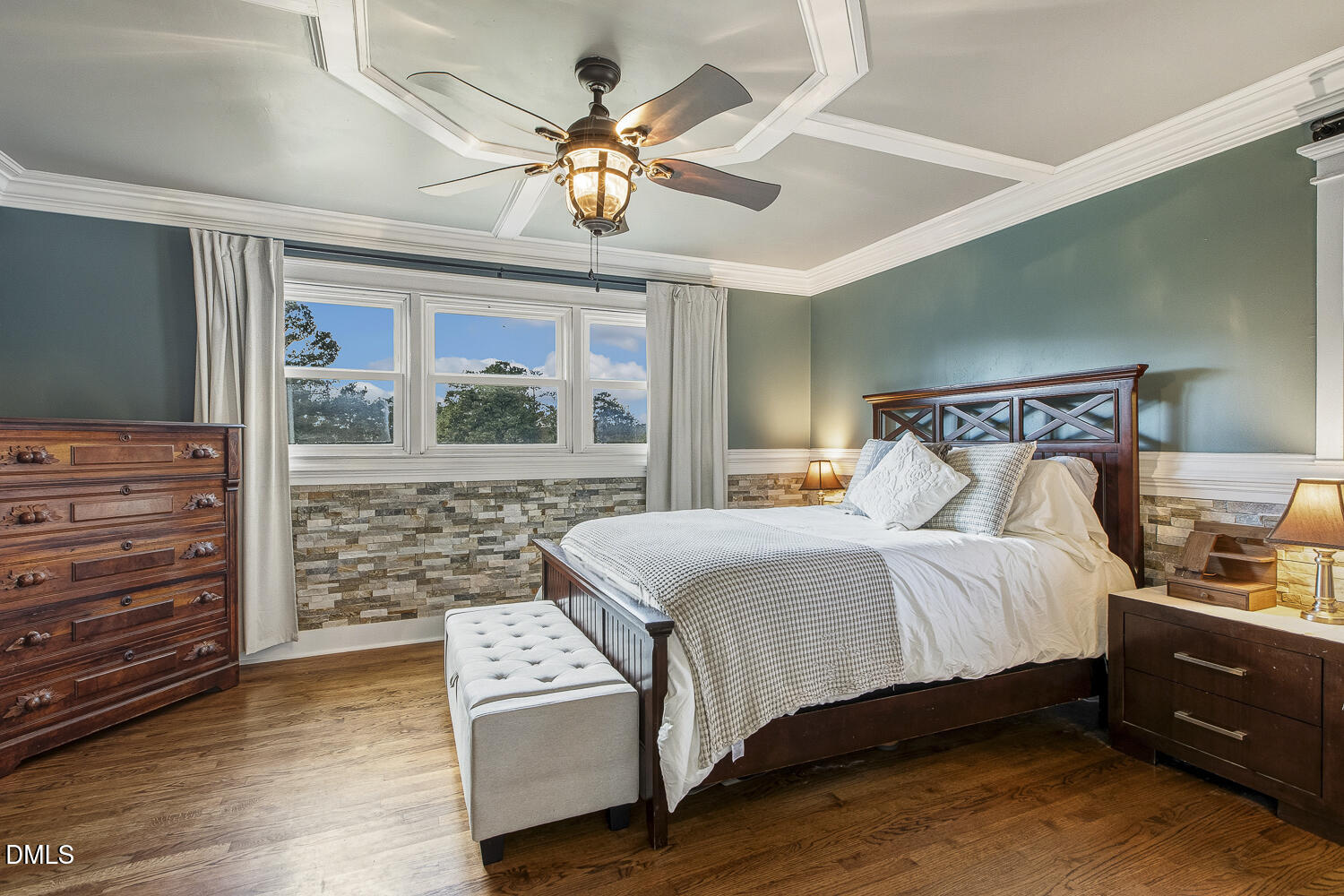 273 Wells Lane Angier, NC 27501 - Photo 26 of 52 a bedroom with a bed and a chandelier