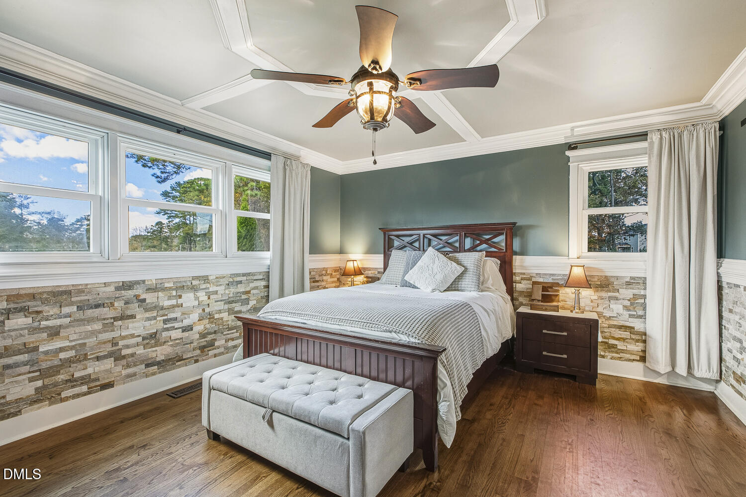 273 Wells Lane Angier, NC 27501 - Photo 27 of 52 a bedroom with a bed and a chandelier