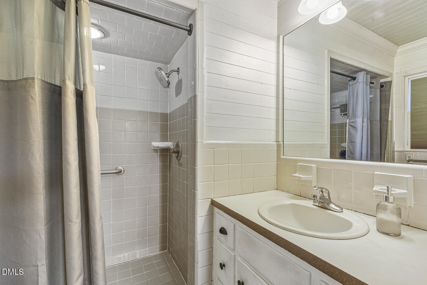 273 Wells Lane Angier, NC 27501 - Photo 28 of 52 a bathroom with a granite countertop sink and a mirror
