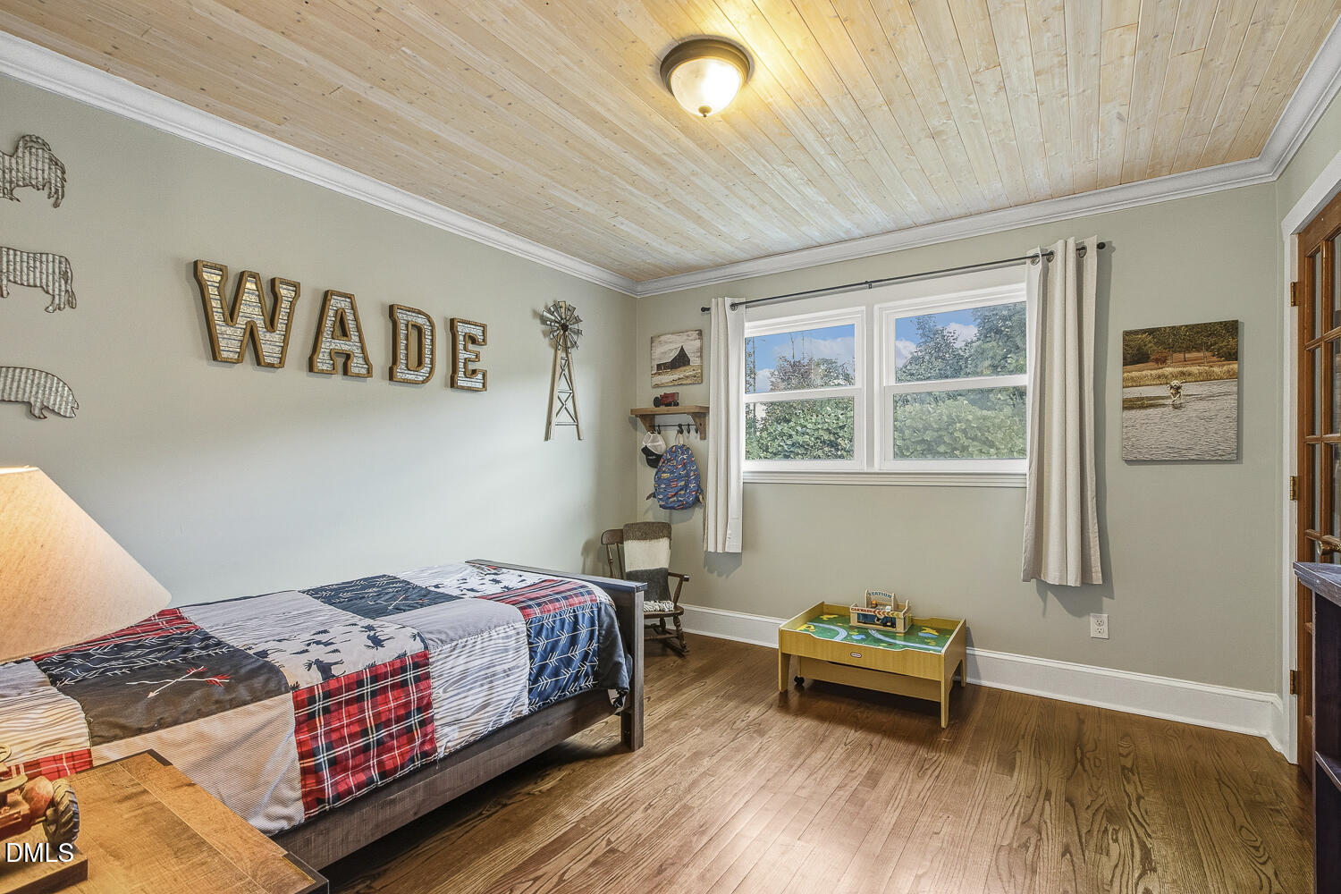 273 Wells Lane Angier, NC 27501 - Photo 29 of 52 a bedroom with a bed and wooden floor