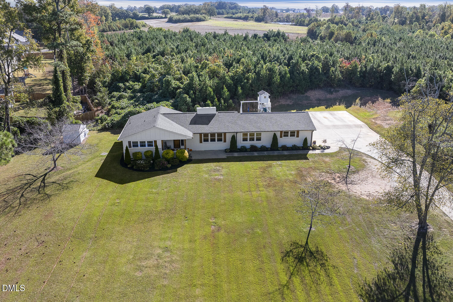 273 Wells Lane Angier, NC 27501 - Photo 44 of 52 an aerial view of a house with swimming pool and green space