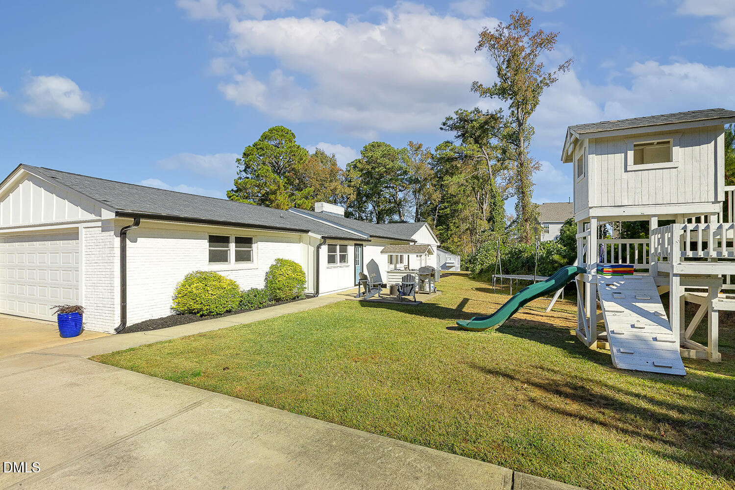 273 Wells Lane Angier, NC 27501 - Photo 45 of 52 a view of a house with backyard and a tree