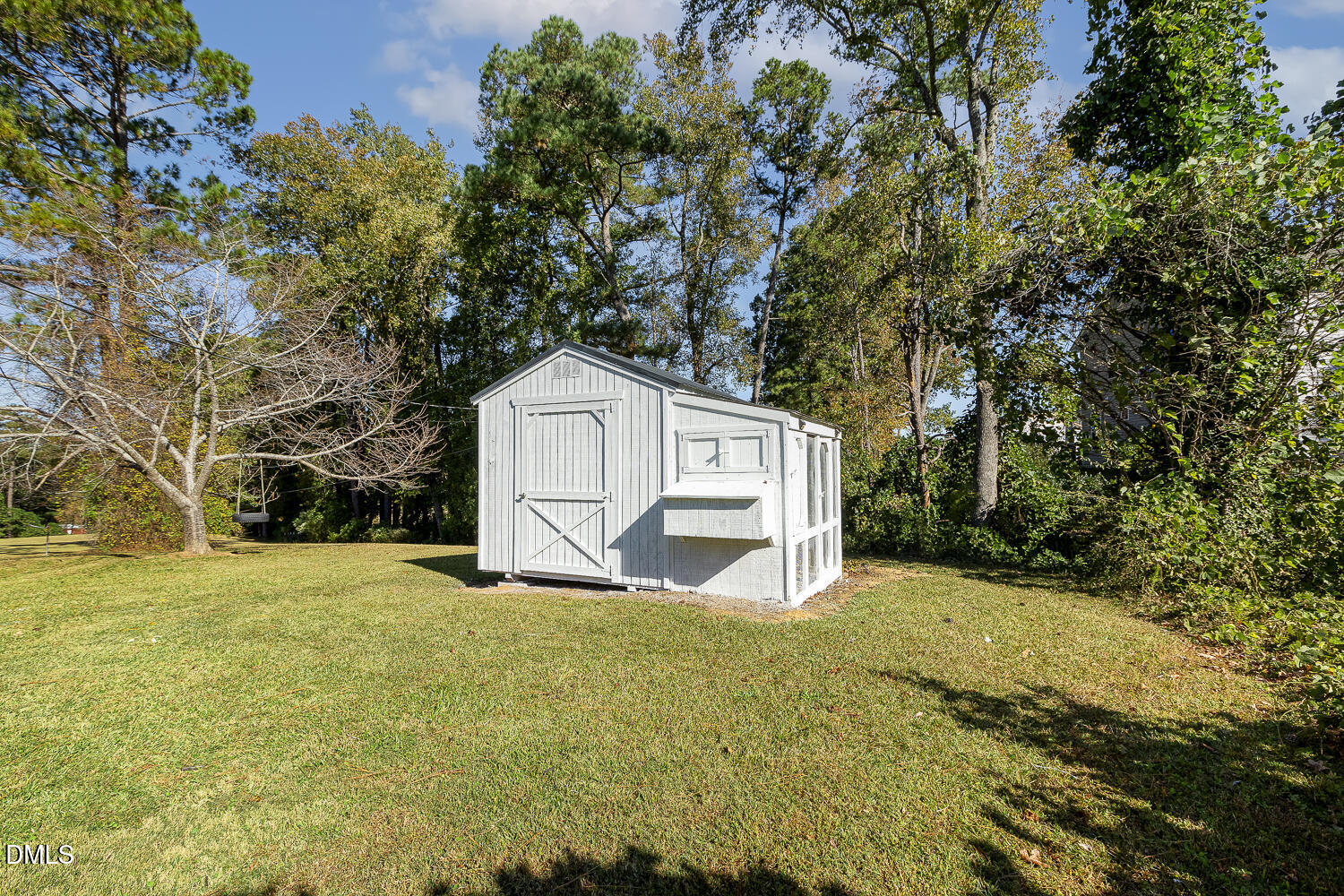 273 Wells Lane Angier, NC 27501 - Photo 48 of 52 a view of a yard with large trees
