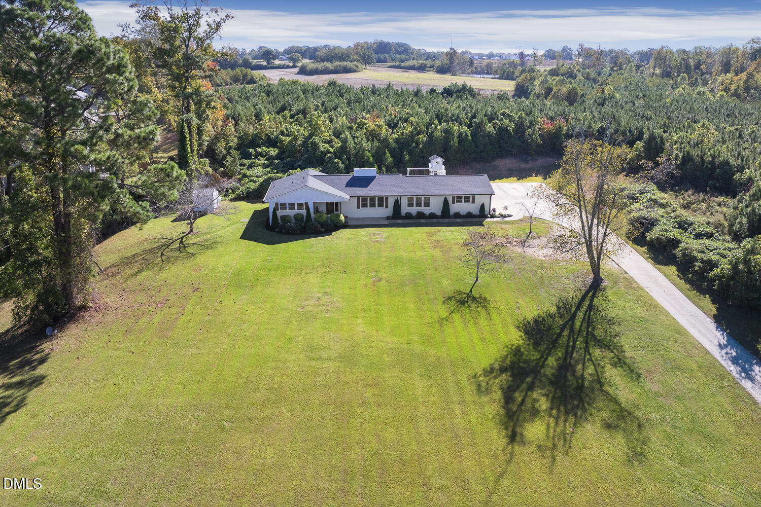 273 Wells Lane Angier, NC 27501 - Photo 50 of 52 a view of a swimming pool with a yard