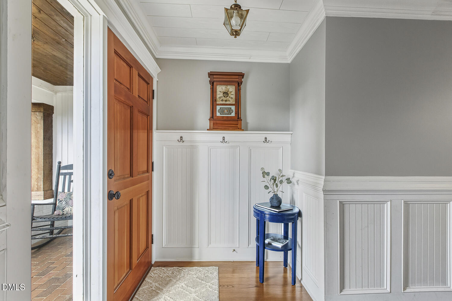 273 Wells Lane Angier, NC 27501 - Photo 7 of 52 a view of a hallway with front door and wooden floor