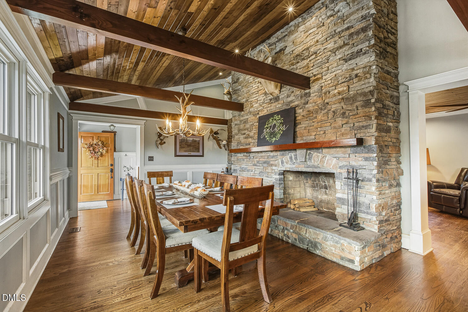 273 Wells Lane Angier, NC 27501 - Photo 8 of 52 a dining room with furniture a fireplace and wooden floor