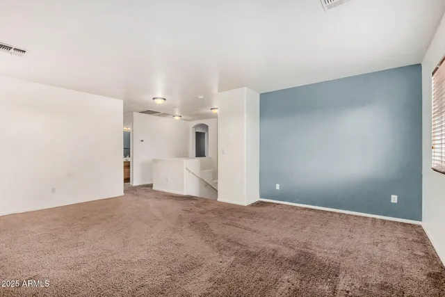 a view of a big room with a kitchen