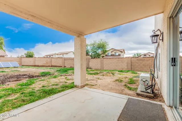 a view of a back yard from a balcony
