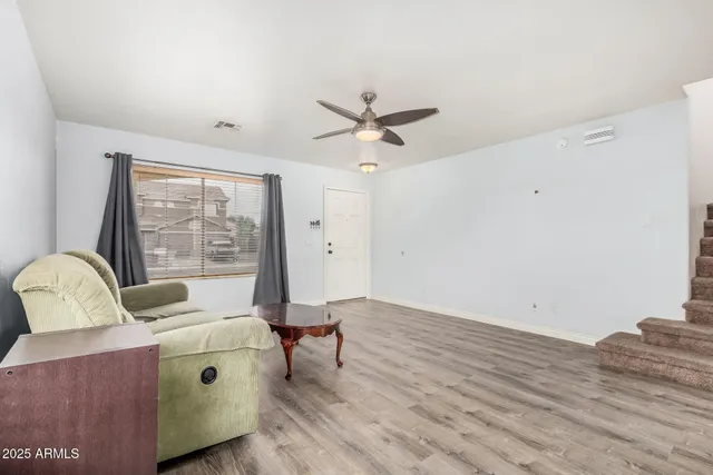 a living room with furniture and a window