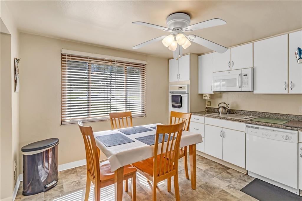 203 Beech Road Pittsburgh, PA 15239 - Photo 6 of 21 a view of a dining room with furniture and chandelier