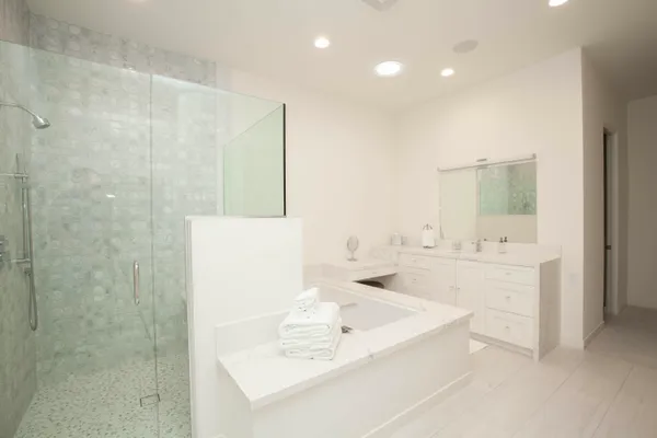 a bathroom with a bathtub and a sink