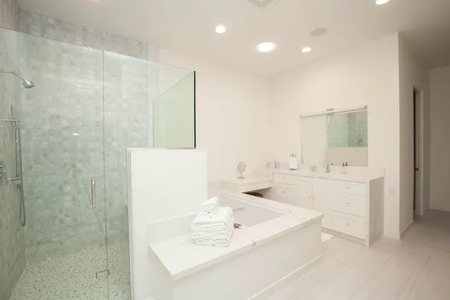 a bathroom with a bathtub and a sink