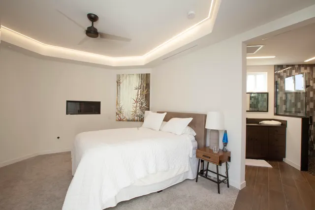 a bedroom with a bed and a couch