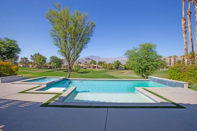 a view of swimming pool with a yard