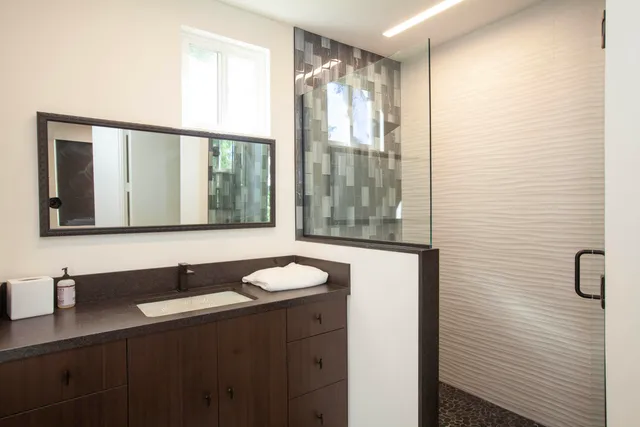 a bathroom with a sink and a mirror