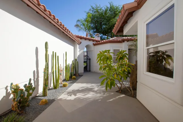 a couple of potted plants in front of a door
