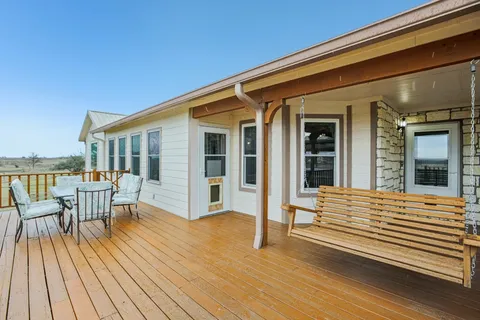 a view of a house with sitting area and furniture