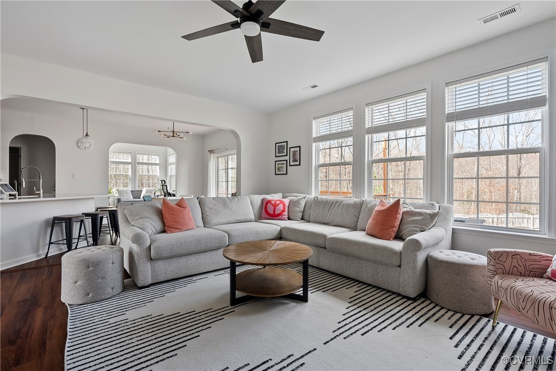 2112 Tomahawk Ridge Place Midlothian, VA 23112 - Photo 13 of 50 Living area with arched walkways, dark wood-style
