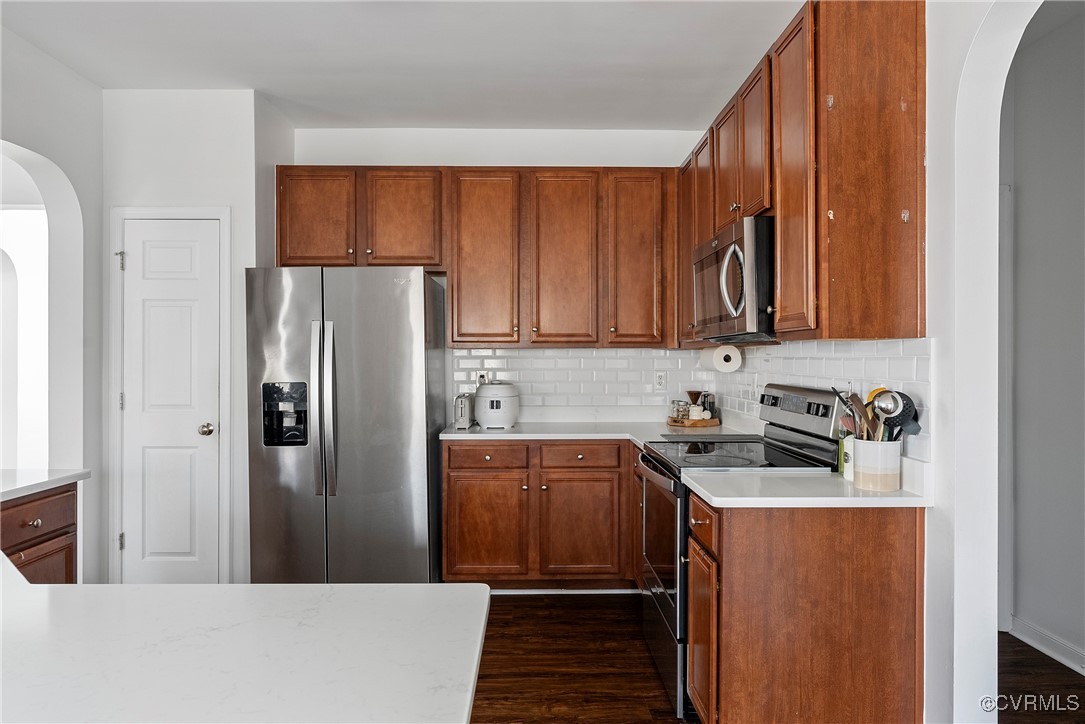 2112 Tomahawk Ridge Place Midlothian, VA 23112 - Photo 15 of 50 Kitchen with arched walkways, light countertops, s
