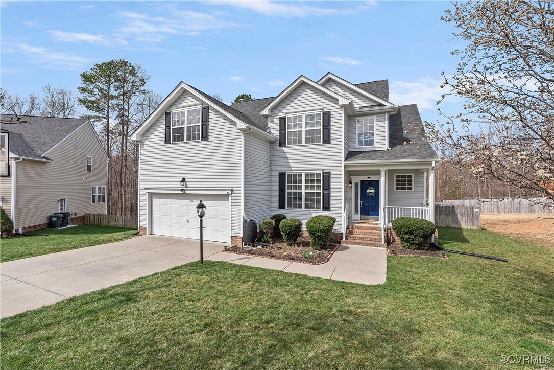 2112 Tomahawk Ridge Place Midlothian, VA 23112 - Photo 3 of 50 Traditional-style home featuring driveway, an atta