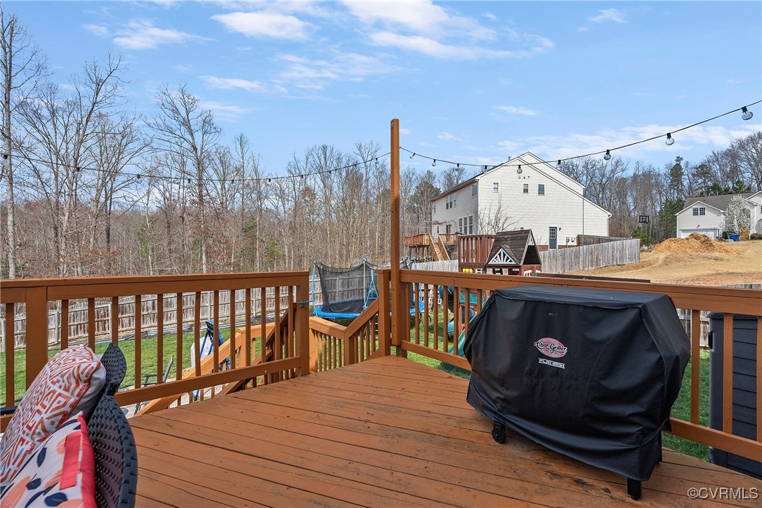 2112 Tomahawk Ridge Place Midlothian, VA 23112 - Photo 49 of 50 Deck with grilling area and a trampoline