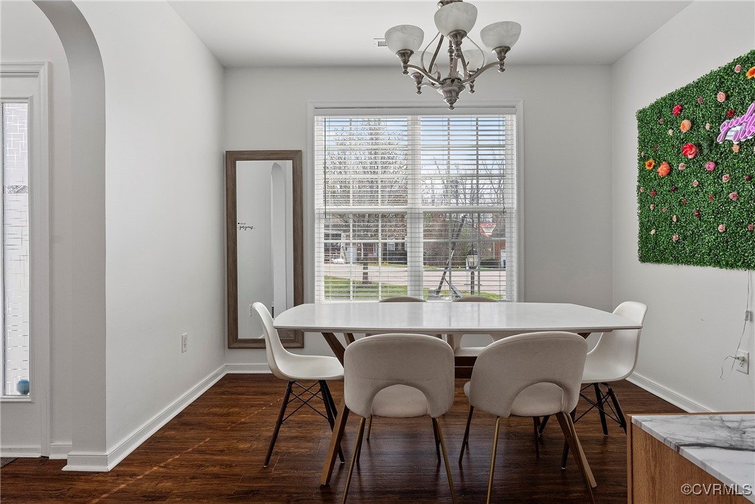 2112 Tomahawk Ridge Place Midlothian, VA 23112 - Photo 8 of 50 Dining space featuring arched walkways, dark wood-