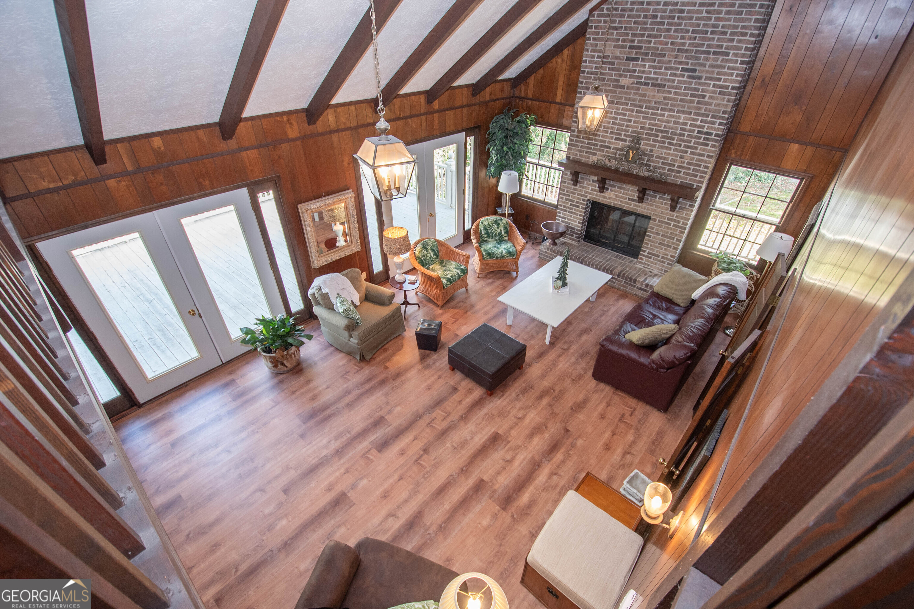 151 Evans Road Milner, GA 30257 - Photo 18 of 60 a living room with furniture wooden floor and large windows