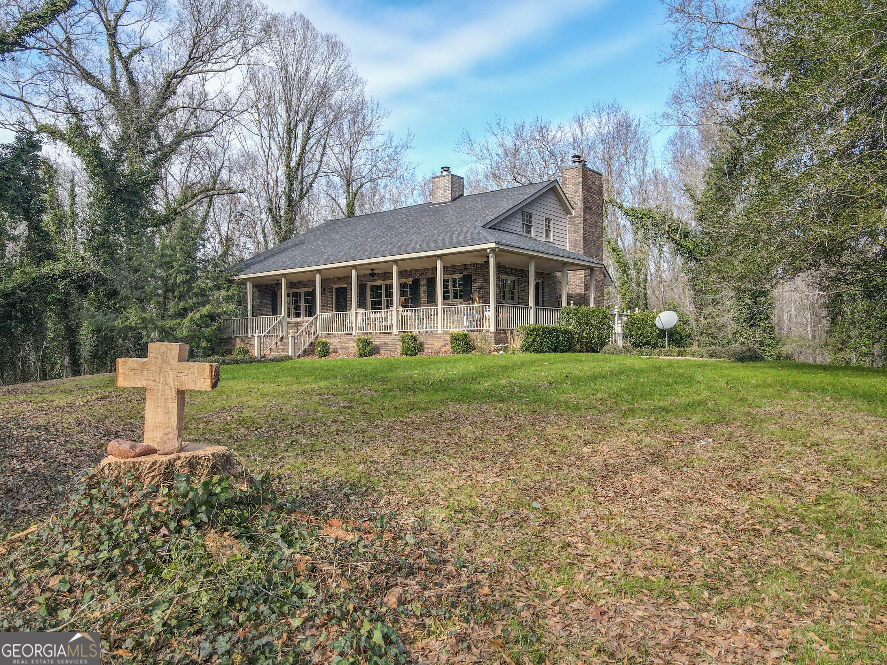 151 Evans Road Milner, GA 30257 - Photo 32 of 60 a front view of a house with a yard and trees
