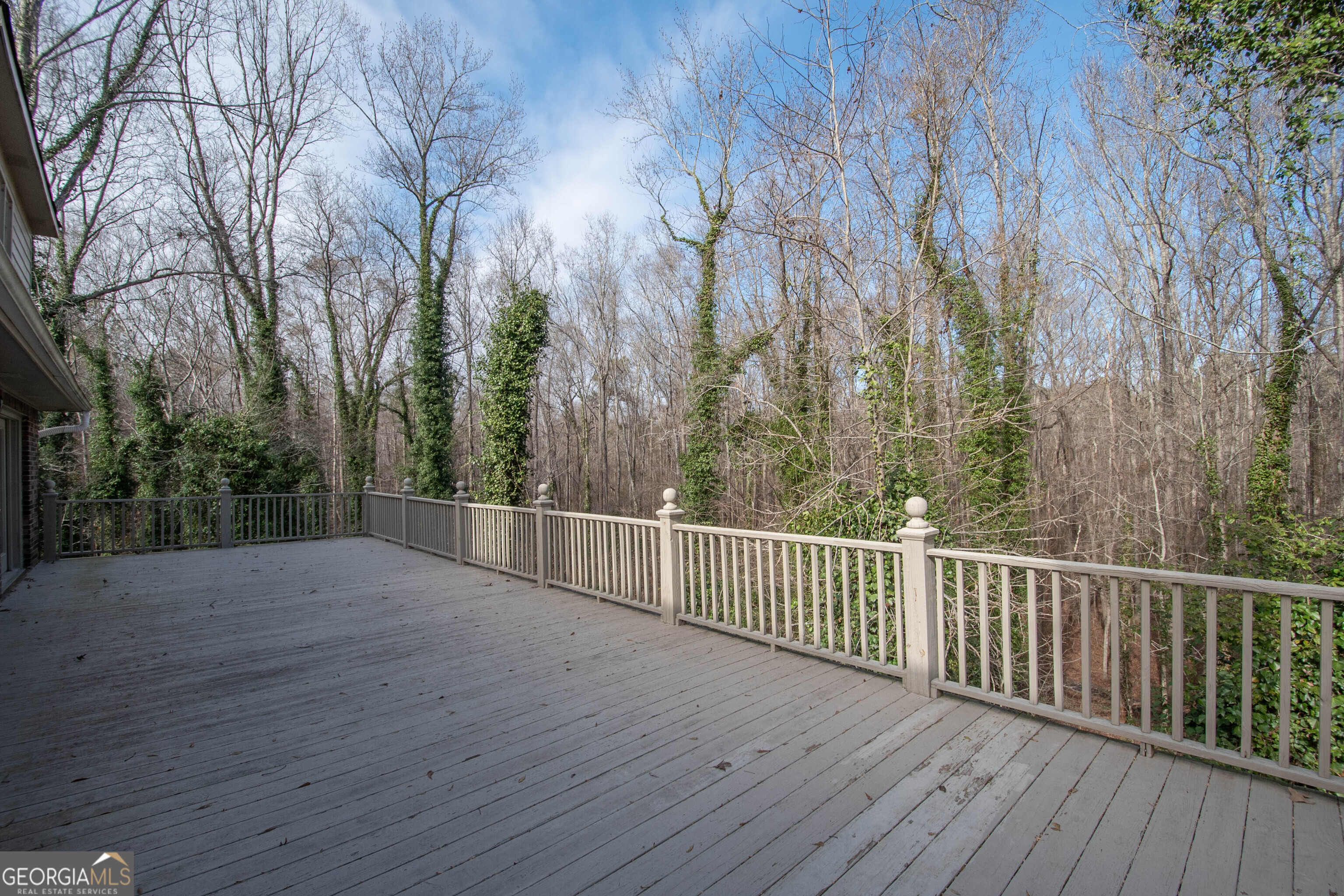 151 Evans Road Milner, GA 30257 - Photo 34 of 60 a view of a roof deck with wooden fence