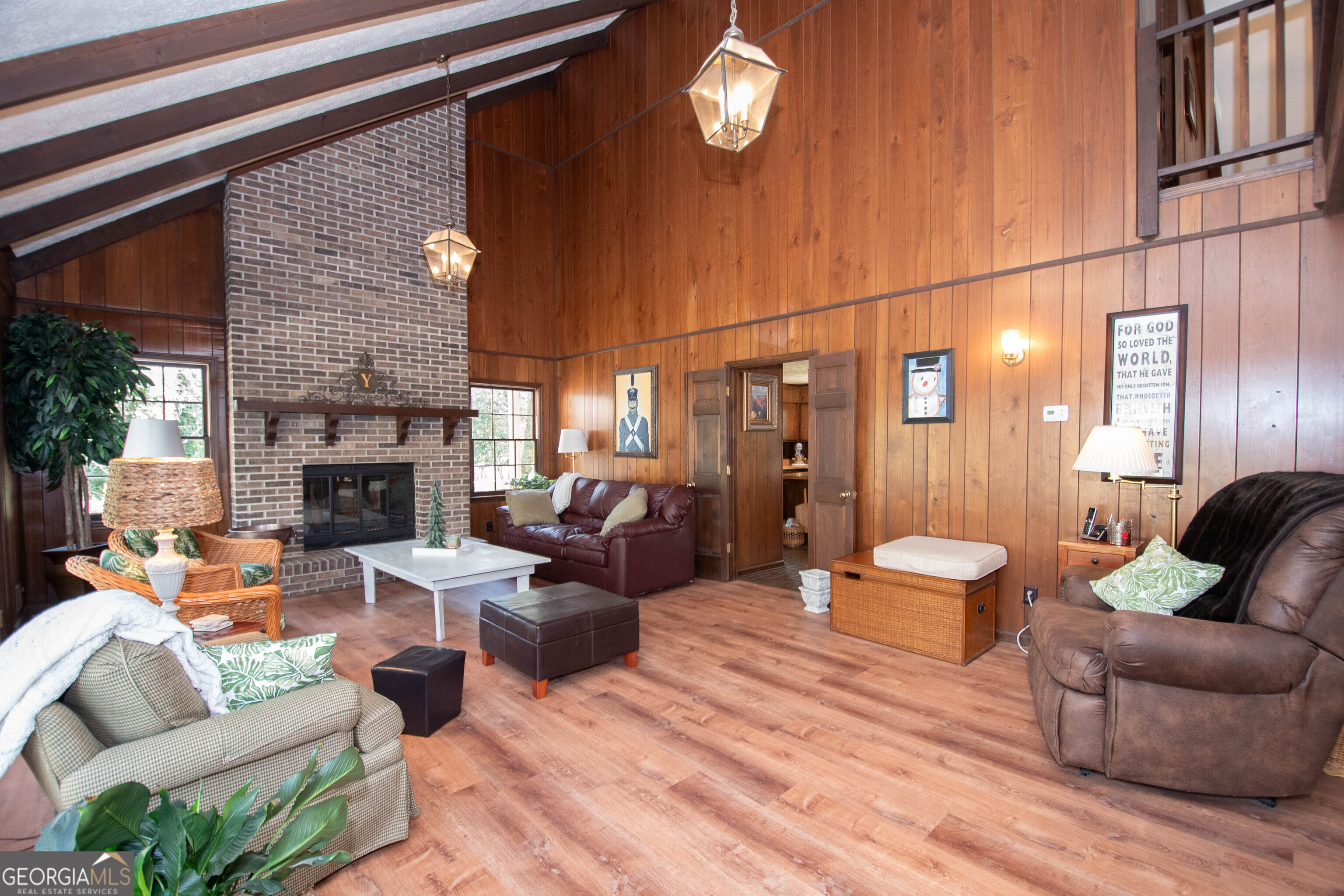 151 Evans Road Milner, GA 30257 - Photo 4 of 60 a living room with furniture a fireplace and a flat screen tv
