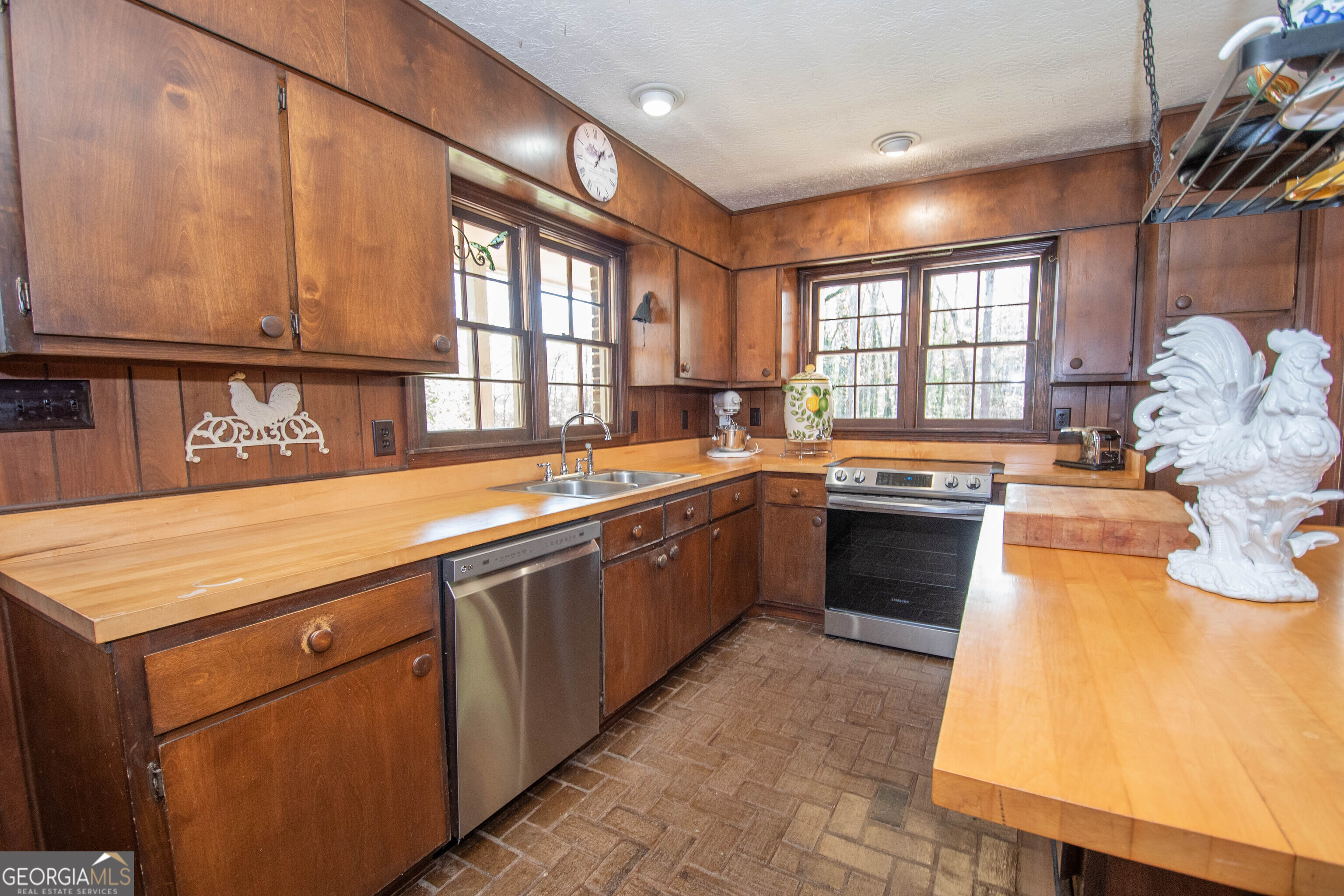 151 Evans Road Milner, GA 30257 - Photo 44 of 60 a kitchen with a sink stove and cabinets