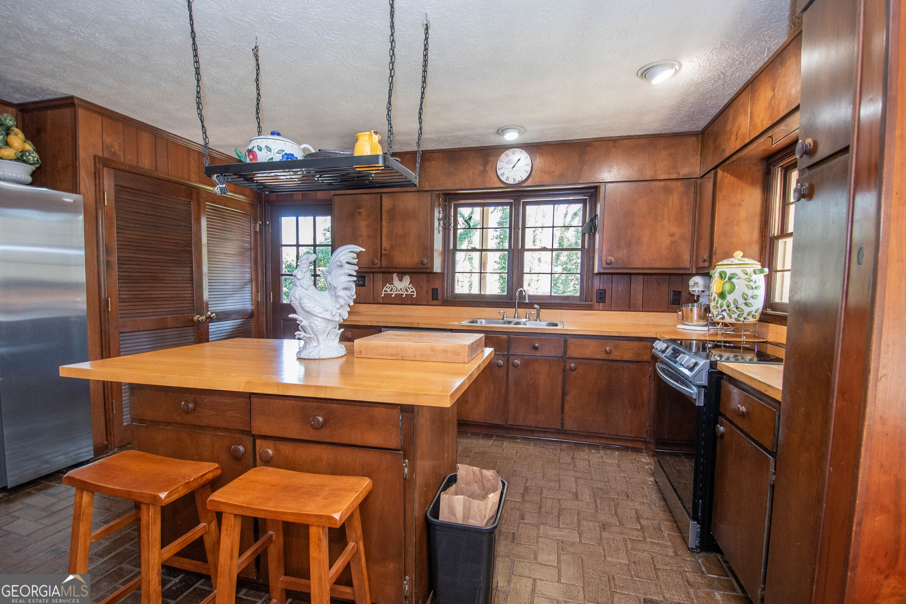 151 Evans Road Milner, GA 30257 - Photo 45 of 60 a kitchen with granite countertop a sink and a stove